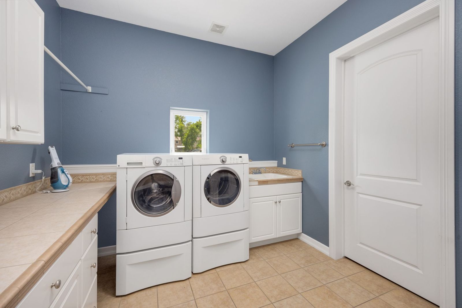 Laundry room with a washer and dryer and folding space